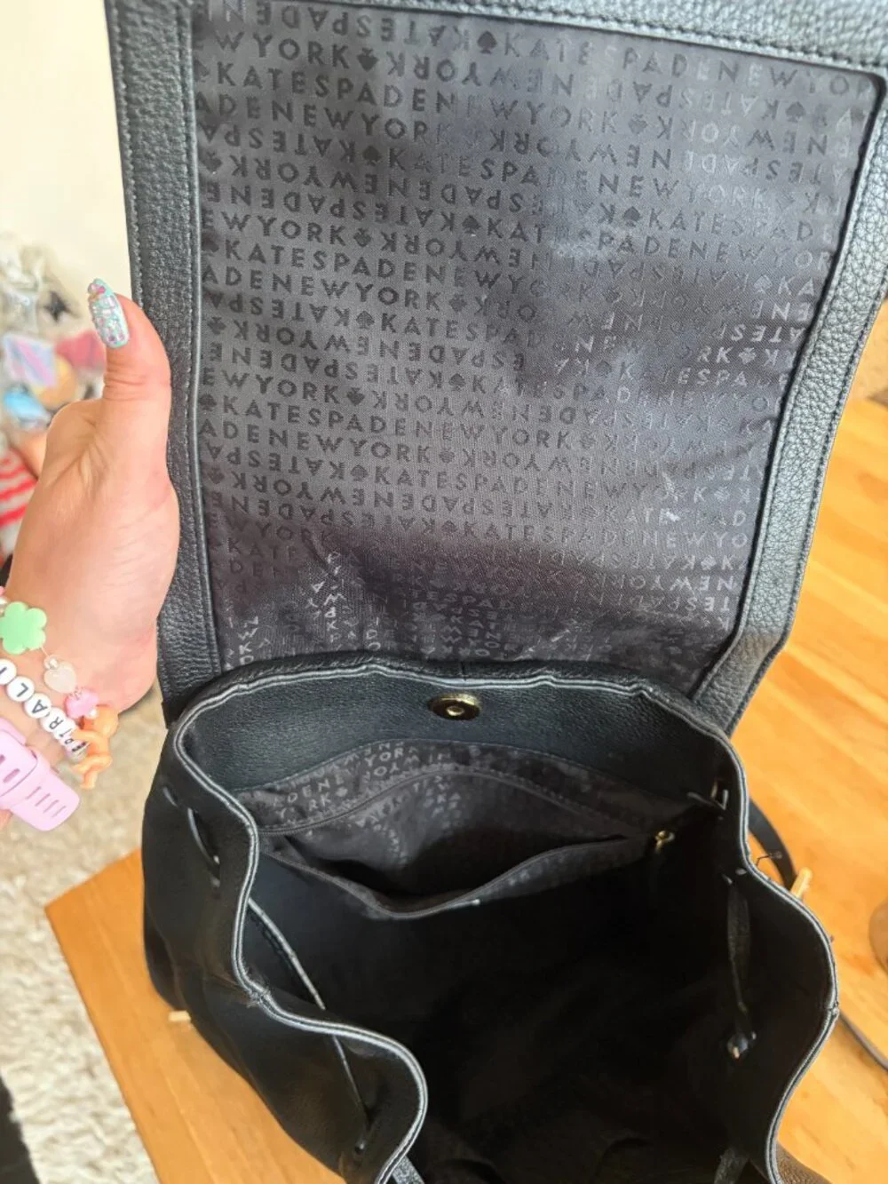 Kate Spade Pebbled Leather Backpack with tassles